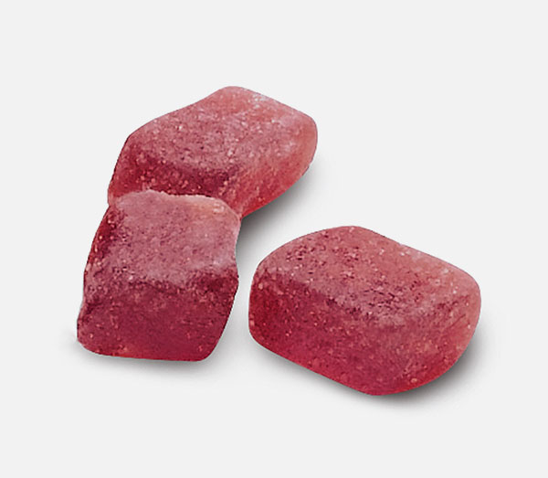 Reducción de azúcar Tres trozos de un gránulo de fruta de cerca.
