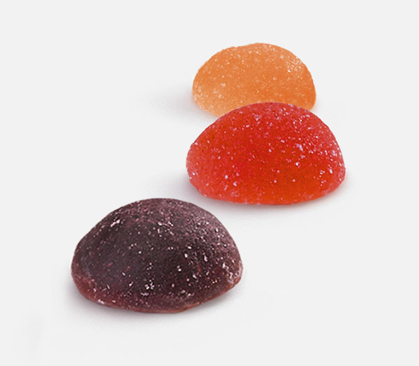 Ein violetter, roter und orangefarbener Fruit Juice Drop, die nebeneinander angeordnet sind.