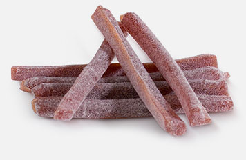 A pile of long bars made of fruit gum.