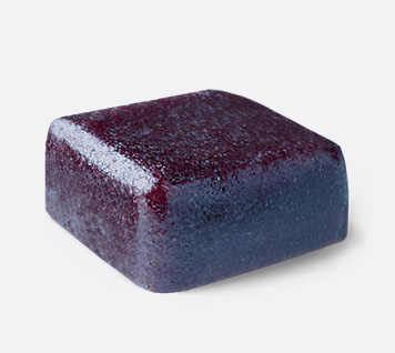 A single cube-shaped fruit gum.