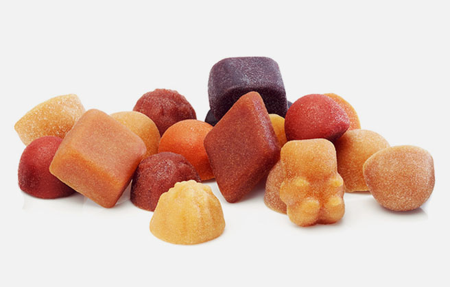 Vitamin fruit gums in various shapes and colors.