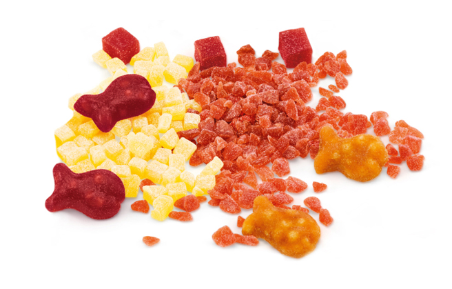Fruit granules of different cut sizes mixed with fish-shaped fruit gums.