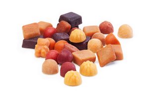 A mix of vitamin fruit gums in various shapes and colors.