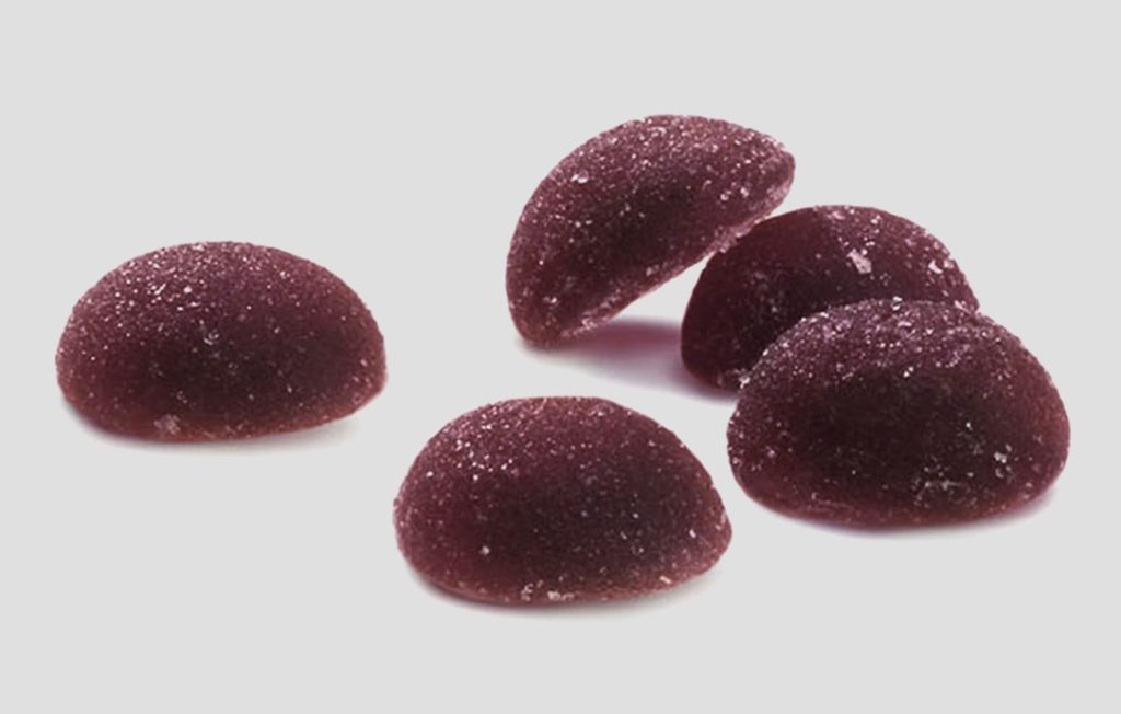 A bunch of purple fruit juice drops.