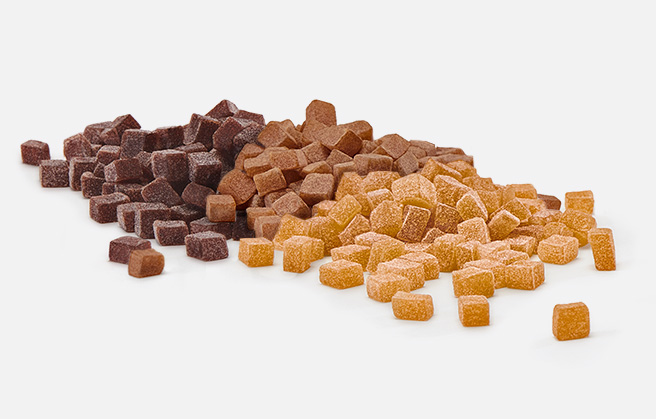 A mix of dark brown, light brown and orange colored fruit granule.