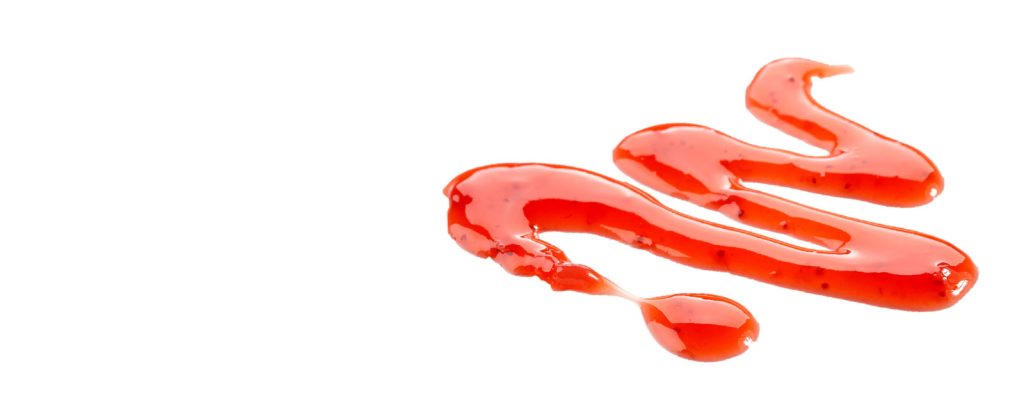 Strawberry fruit paste in a serpentine line.