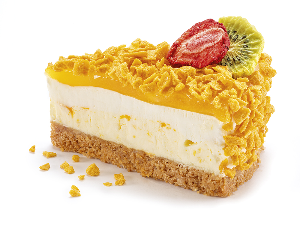 Slice of cake with fruity mango crunch topping.